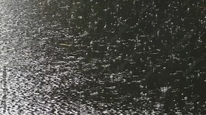 Rain drop water falling splashing on wood terrace, Rainfall sprinkle scene pouring rain rainy weather with the sound of rain.