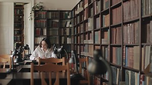 Educated woman studies for exam in university  library - Free Stock Video