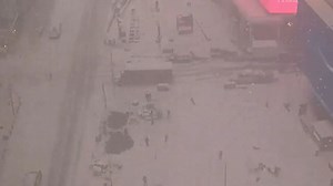 Snow blankets New York City, making it largely invisible from the Empire State Building's summit.