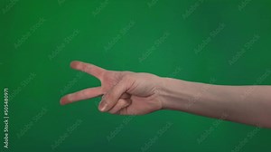 Slow motion Rock paper scissors hand game. one hand side view. Green screen chroma key alpha matte. Hand gestures competition. Make choice. Random selection methods. Winner loser tournament. Play game