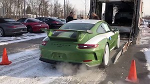 51K views · 2.1K reactions | Perhaps the only thing better than SEEING your new car coming off the truck is DRIVING your new car off the truck! 911 (991.2) GT3 in Paint-To-Sample Olive Green with a manual. | Porsche Exchange | Facebook