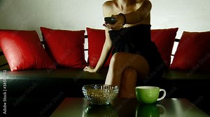 Woman watching tv on the sofa