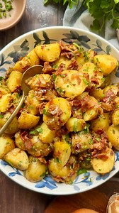 this is the best potato salad, EVER! My nana’s german potato salad is tossed in a bacon dressing, instead of mayo, & it’s possibly the best thing you’ve ever tasted. Serve the potato salad warm or cold. Recipe below👇 Ingredients: 1.5 lbs (24oz bag) petite golden potatoes 1 yellow onion, chopped 1 lb bacon 1/2 cup vegetable broth 1/3 cup apple cider vinegar 1 tablespoon dijon mustard 2 tablespoons honey, maple syrup or sugar Sprinkle of salt & pepper Chopped chives, for garnish Chopped parsley, 