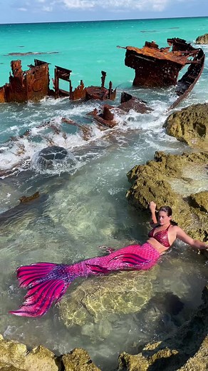 Enchanting Mermaid Swimming in Turquoise Water