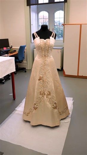 Conserving a dress originally worn to Queen Elizabeth II’s Coronation ✨ This beautiful dress, on loan from Royal Collection Trust / and with the kind permission of The Duke and Duchess of Gloucester, was originally designed for Princess Alice, the Duchess of Gloucester, to wear to Queen Elizabeth II’s Coronation in 1953. 🎥 Watch Textile Conservator Katica Laza prepare the dress for display, in the studio at Hampton Court Palace. 👗 Now on display in the Jewel House at the Tower of London. | Tow