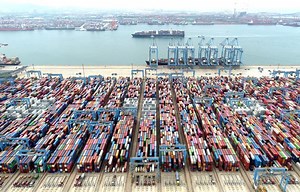 China's exports seen expanded in July lifted by global trade upturn