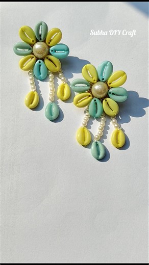 Beautiful earrings from Cowry shells💛💚🤍#diy#handmade#earrings#explore#ytshorts#shortsfeed#foryou