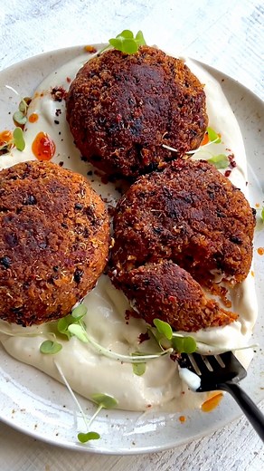 These vegan Quinoa Black Bean Burgers are easy, healthy, and packed with protein and iron. No food processor is needed. Just one bowl! Jarred sun-dried tomatoes transform these patties into the ultimate flavor bomb! Plus, they're loaded with lycopene, a powerful antioxidant, and gut-healthy fiber. #veganrecipes #quinoa #healthyrecipes #VeganBurger | Cooking for Peanuts