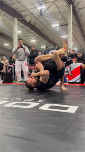 Sloan "Caveman" Clymer on Instagram: "Triangle set up from failed arm crush sweep. In this clip, I am setting up an arm crush sweep. My opponent senses danger and decides to get on both feet, attempting to shrug out of my grip. This provides space for me to put my feet on his hips. As I kick off his hip with my right leg to create a perpendicular angle between our bodies, my left foot goes over his back and behind his neck, putting it in perfect position for my right leg to come up and secure a 