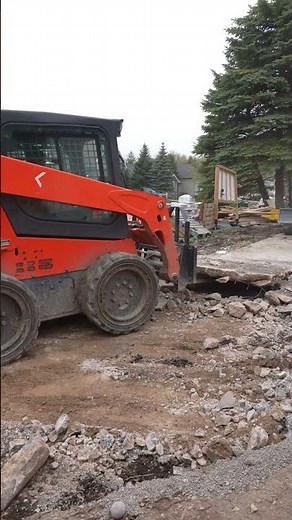 Bobcat E88 with a hydraulic breaker attachment | Driveway Demolition