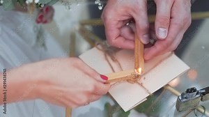 Stamp sealing with candle wax burning at a polish wedding ceremony, closeup