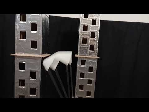 A Lego man jumps with a parachute made from a paper napkin