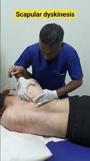 Scapular mobilization to improve scapular motion in a patient with restricted shoulder flexion.