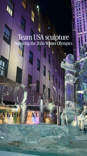 Team USA ice sculpture at Rockefeller Center 🇺🇸❄️ I stopped by Rockefeller Center and found this 12 foot tall ice sculpture honoring Team USA and the upcoming Milano Cortina 2026 Winter Olympics. Carved from 10 metric tons of ice in the Channel Gardens, the sculpture features three Team USA athletes. Madison Chock in figure skating, Red Gerard in snowboarding, and Brenna Huckaby in para snowboarding. Each is shown wearing Ralph Lauren’s official Team USA ceremony uniforms, carved entirely in i