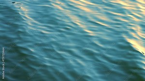 Beautiful reflection golden sun light on blue water, rippled waves, calm natural crystal clean water, fresh, effect, scene, sea, wet, wavy, pool, sunset, shine, slow motion, close up, hd. ProRes 422HQ