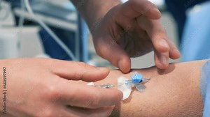 Elderly woman on operating table, attended by skilled surgeons.