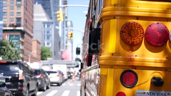 Yellow School Bus on New York Manhattan street, schoolbus truck on...