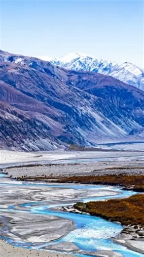 Nubra Valley is a place one must visit at least once in a lifetime — where silver sands ripple beneath vast skies, and snow-laden peaks stand like timeless guardians. The Shyok River carries whispers of ancient journeys, weaving through a landscape where silence feels sacred and beauty stretches beyond sight. Among serene monasteries, wandering camels, and the calm breath of the cold desert, every moment becomes something you hold close long after the journey ends. #ladakhtourism #nubravalley @m