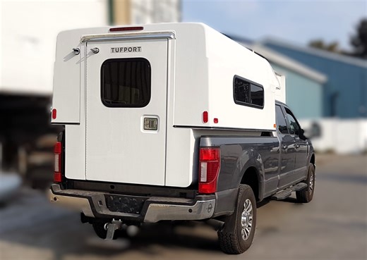 This Fiberglass Truck Camper Is Crazy; They Tested It as a Boat Just To Prove a Point!