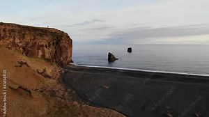 Dyrhólaey / Dyrholaey view point and its surrounding from an aerial drone 4k point of view, around the endless black sand beach during sunset, part5 Stock Video
