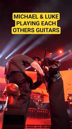 5SOS Michael and Luke playing each others guitars