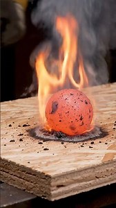Created with Klipx.app - Red-Hot Iron Sphere Meets Particle Board — Realistic AI Heat Simulation