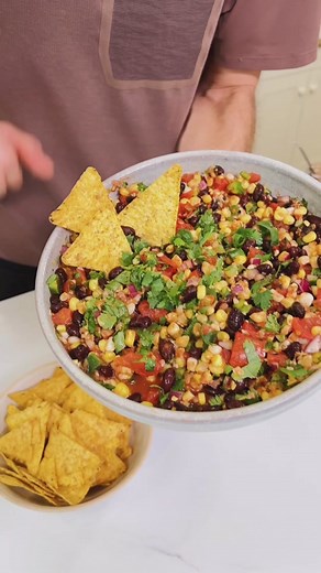It doesn’t have to be Cinco de Mayo to enjoy this corn and black bean salsa, but it’s perfect for the holiday! - 2 cups sweet corn, frozen (thawed) or canned - 1 can fire-roasted tomatoes - 1 can black beans, drained and rinsed - 1/2 cup diced red onion - 1-2 tsp chipotle powder - 1 jalapeño, seeded and diced - 2 tsp lime zest - 1 tbsp lime juice - 1 tsp kosher salt - 1/2 cup chopped cilantro #salsa #recipe #appetizer #cincodemayo