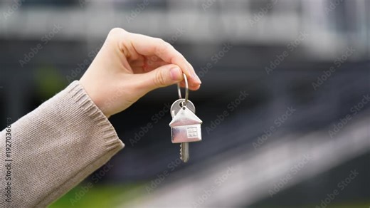 Woman Realtor Holds House Key, Happy Buyer Books New Apartment. Realtor Welcomes New Tenant, Client Rents And Moves Into Modern Housing. Investment, Real Estate Buying, Property Renting, Urban Living.