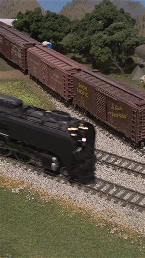 UP #844 pulling a passenger train on the MARRS ho scale layout.
