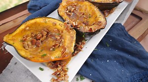This easy recipe for grilled brown sugar acorn squash will have you wondering why you never tried it before! Hands down, one of our favorite ways to cook winter squash, this easy recipe has everyone loving squash and asking for more! Full #recipe at hhttps://www.cowboycharcoal.com/grilling-bbq-recipes/sides/grilled-brown-sugar-acorn-squash #grilling #grilledshrimp #cookinwithcowboy | Cowboy Charcoal