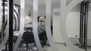 A diverse group of businessmen collaborates and tests a new virtual reality technology, wearing virtual glasses, showcasing innovation and creativity in their futuristic workspace