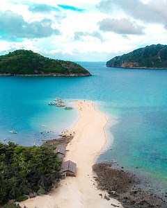 Bantigue sandbar has a brownish color that turns into golden hue during sunset🌊 📍Carles Iloilo, Philippines | Travalexis