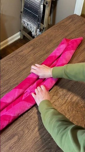 Woman shows how to make a cute Easter basket out of beach towels!