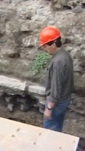 In 2006, archaeologists excavating the Templo Mayor in central Mexico City uncovered a massive carved stone monolith depicting Tlaltecuhtli, the Aztec earth deity. The monolith, dating to around 1502 CE, was found face up at the base of the temple complex and is believed to mark the burial place of an Aztec ruler, likely Ahuitzotl. Nearby excavations revealed a richly furnished ritual offering that included the burial of a dog, along with shells, obsidian, and other ceremonial objects. In Aztec 