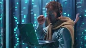 Tricky young man hacker typing on laptop computer making total power collapse in data center. Scared female administrator staying in dark server room. Error.