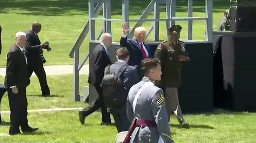 Trump walks slowly down ramp after West Point commencement speech