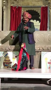 Man Entertains Crowd With Puppet Dance