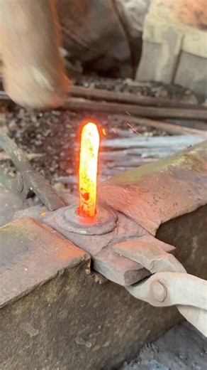 Watch Forge Apprentices Flatten Heated Brass Blocks Using Heavy Sledges⁠