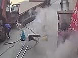 Mum and child are blown away by exploding tyre in Danjiangkou