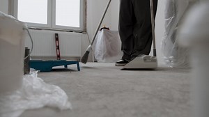 Construction Worker Sweeping Up After Renovation | Free Stock Video Footage