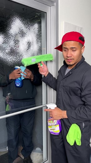 Scary man helps janitor to clean window