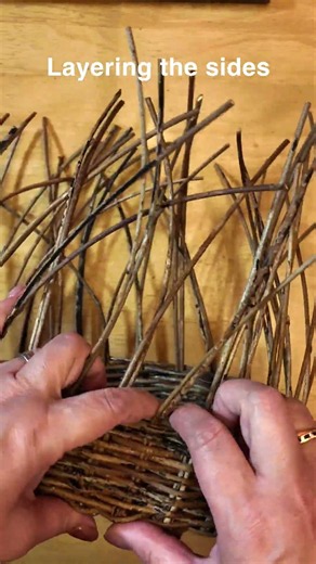 Layering the sidesOne row at a timeWith natural Akebi. #garden #basket #basketweaving #craft