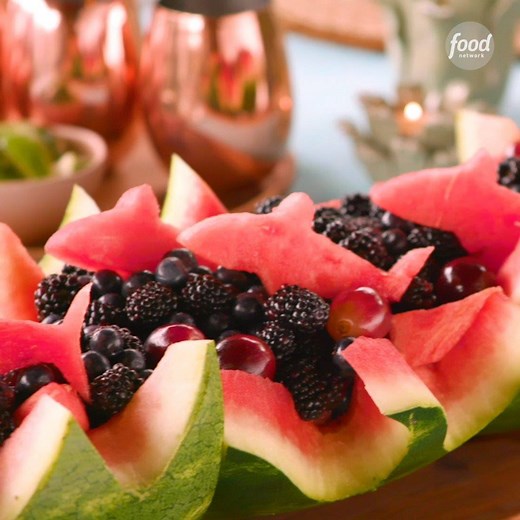 This carved watermelon bowl is sure to make WAVES at your family's Shark Week viewing party 🍉🌊 Watch out for watermelon-shaped sharks! 🦈 | Food Network