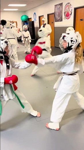 Sparring drills help students develop timing, coordination, focus, control, and confidence