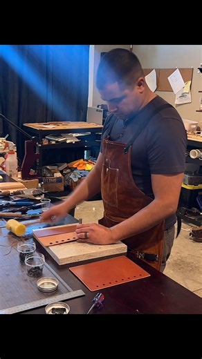 One of the many satisfying processing of working in the shop is setting the grommets for my checklist covers. #robinriversleather #checklist#leather