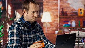 Man has difficulties while internet shopping, receiving errors after typing credit card information on laptop. Frustrated shopper sees insufficient funds popup after adding payment method, camera B