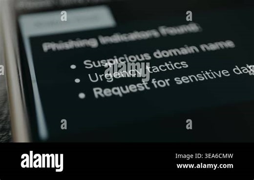 A list of phishing indicators appears on screen, including suspicious domain, urgency tactics, and sensitive data requests Stock Video Footage - Alamy