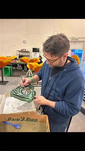 Danny Pintauro on Instagram: "So today, Wil and I did one of the coolest things ever! Since I was a child, I’ve always wanted to go and decorate the Rose Bowl parade floats. I figured out how to volunteer and signed us up for today. We started by working on these beautiful dragon pieces, but as soon as the guy running the place, saw my tweezers he instantly put me on detail duty. We were making miniature stained glass windows, I had to glue onion seeds, one by one in a line. as you all know, I’m