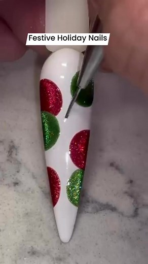 Get ready for the holidays with this festive and sparkly nail art! I'm loving these holly-inspired glitter dots and silver vines. What do you think? Let me know in the comments! #ChristmasNails #HolidayNails #NailArt #NailDesign #ChristmasNailArt #FestiveNails #GlitterNails #NailTutorial #DIYnails #Manicure #NailInspo #NailsofInstagram #BeautyTips #NailArtist #FacebookReels #ViralNails | Just U&I Nail Spa
