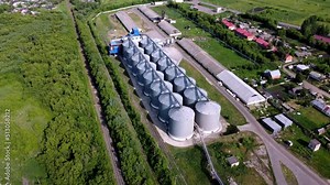 Modern grain silo elevator, view from a height and from different angles. Grain storage tanks on top Grain storage in large cells industrial zone for grain processing silos for agribusiness
